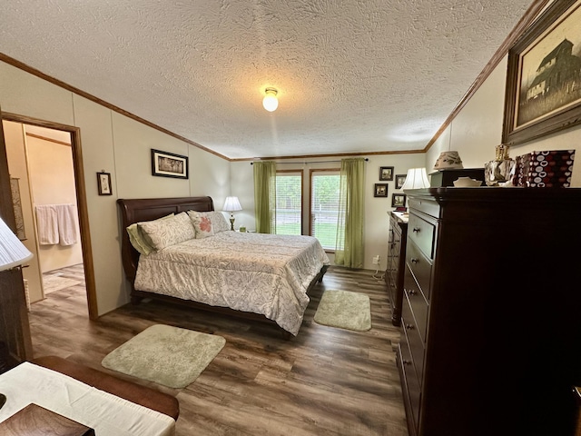 10162 Regimental Way, Grayling, MI 49738 - bedroom featuring ornamental molding, dark wood-style floors, a textured ceiling, and vaulted ceiling
