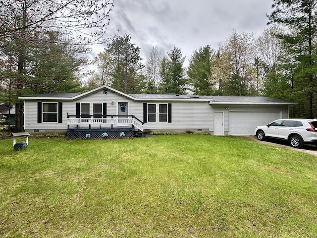 10162 Regimental Way, Grayling, MI 49738 - view of front facade featuring crawl space, a garage, and a front lawn