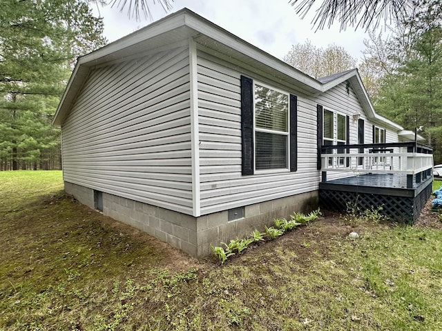 10162 Regimental Way, Grayling, MI 49738 - view of home's exterior featuring a wooden deck and crawl space