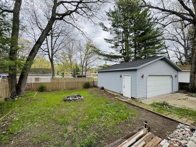 605 Cedar Ave, Houghton Lake, MI 48629 - view of yard with an outdoor structure and a detached garage