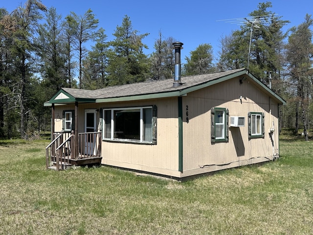269 Dixson Dr, Grayling, MI 49738 - rear view of house featuring a lawn
