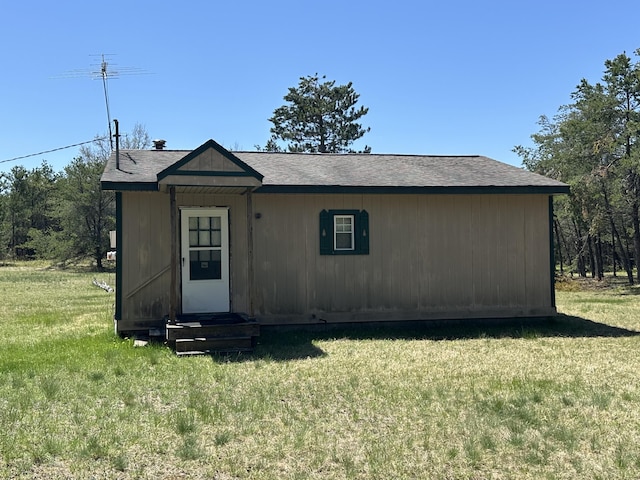 269 Dixson Dr, Grayling, MI 49738 - view of front of home featuring a front lawn and roof with shingles