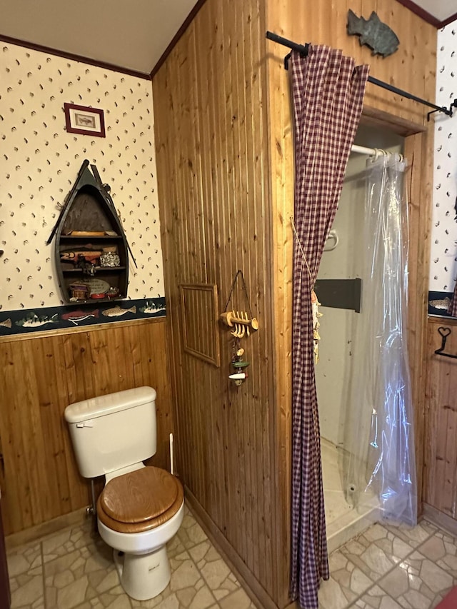 269 Dixson Dr, Grayling, MI 49738 - full bathroom with toilet, wood walls, crown molding, and a shower with shower curtain