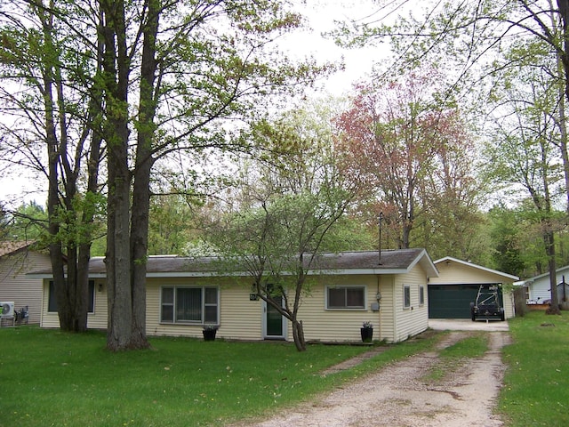 8778 N Townline Rd, Roscommon, MI 48653 - ranch-style house with a front lawn and dirt driveway