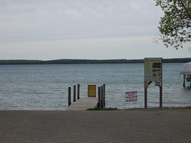 8778 N Townline Rd, Roscommon, MI 48653 - dock area featuring a water view