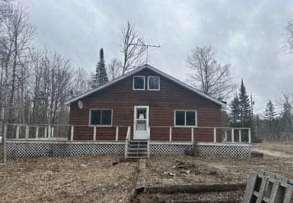 29098 W H 40, Moran, MI 49760 - view of front of house with a wooden deck