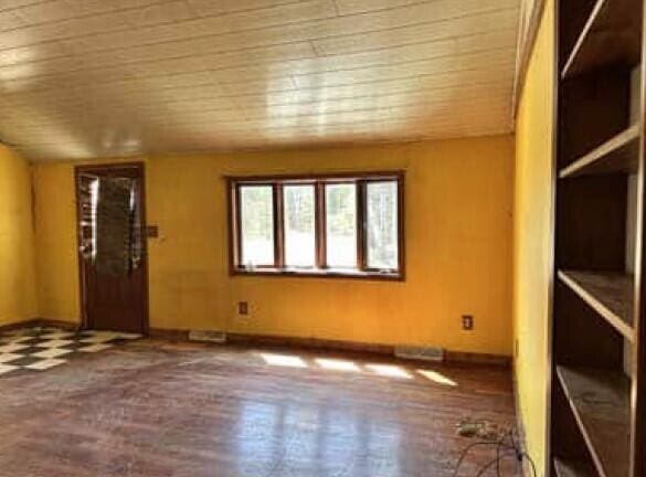 29098 W H 40, Moran, MI 49760 - unfurnished room featuring wooden ceiling and baseboards
