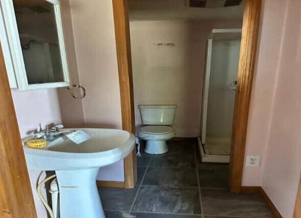 29098 W H 40, Moran, MI 49760 - bathroom featuring a shower stall and tile patterned flooring
