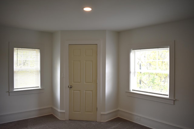 1131 Emmet St, Petoskey, MI 49770 - unfurnished room with dark carpet, recessed lighting, and baseboards