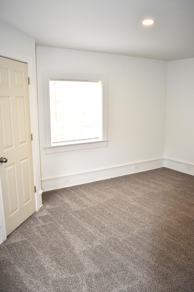 1131 Emmet St, Petoskey, MI 49770 - carpeted empty room featuring recessed lighting