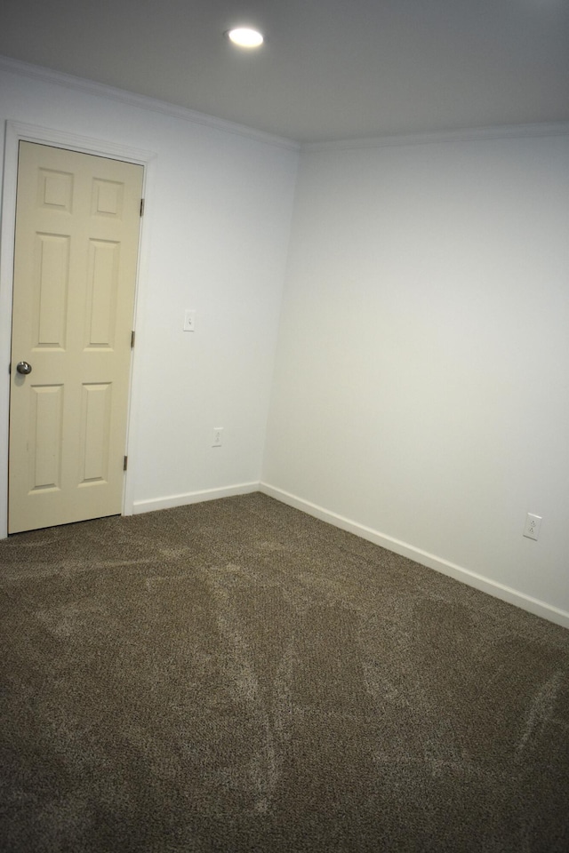 1131 Emmet St, Petoskey, MI 49770 - spare room with dark colored carpet, baseboards, and recessed lighting