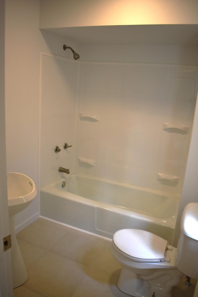 1131 Emmet St, Petoskey, MI 49770 - bathroom with tile patterned flooring, toilet, and shower / bath combination