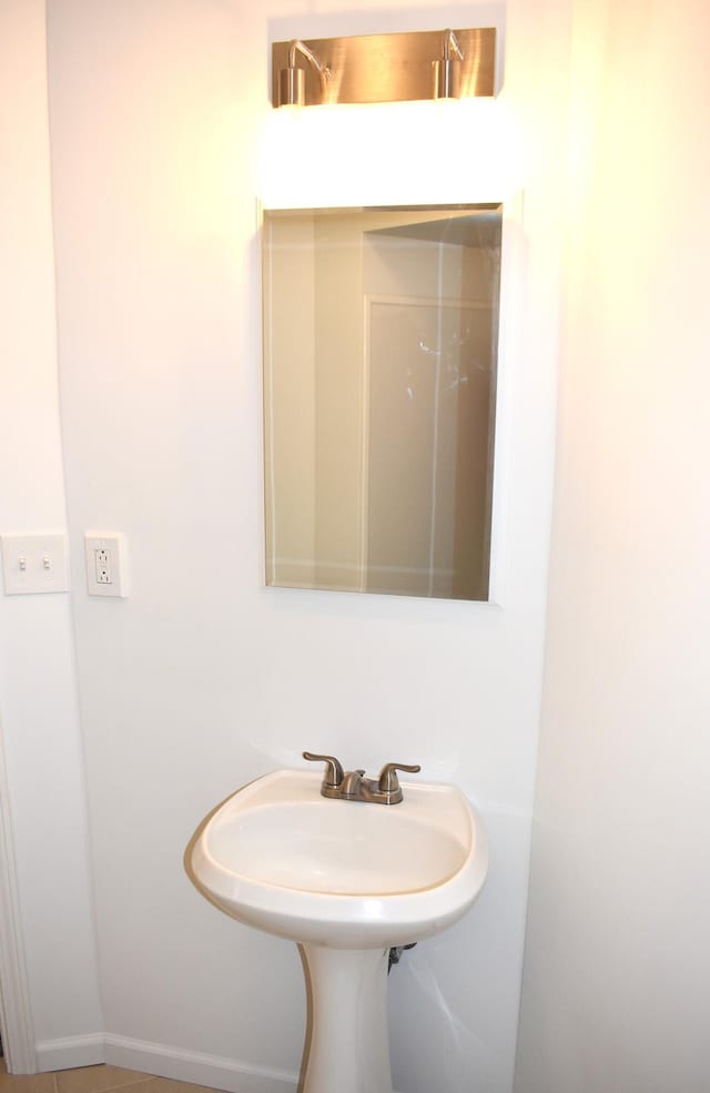 1131 Emmet St, Petoskey, MI 49770 - bathroom with baseboards