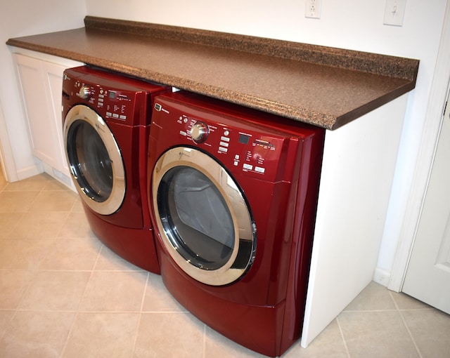 1131 Emmet St, Petoskey, MI 49770 - washroom with washer and dryer and light tile patterned flooring