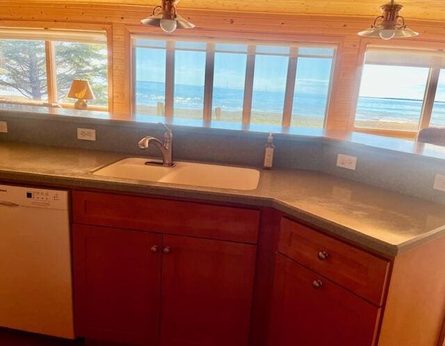 3199 S Lake Shore Dr, Bois Blanc, MI 49775 - kitchen featuring dishwasher, a sink, plenty of natural light, and pendant lighting