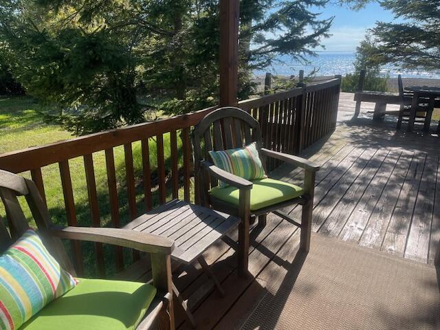 3199 S Lake Shore Dr, Bois Blanc, MI 49775 - wooden terrace featuring a water view