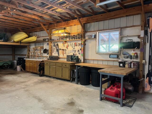 3199 S Lake Shore Dr, Bois Blanc, MI 49775 - garage featuring a workshop area