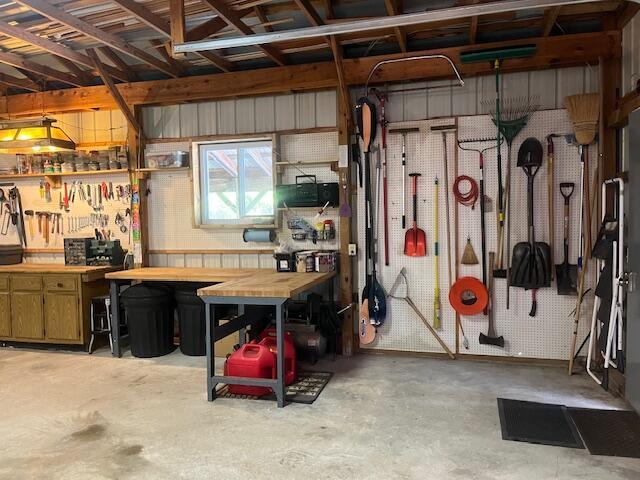 3199 S Lake Shore Dr, Bois Blanc, MI 49775 - garage featuring a workshop area