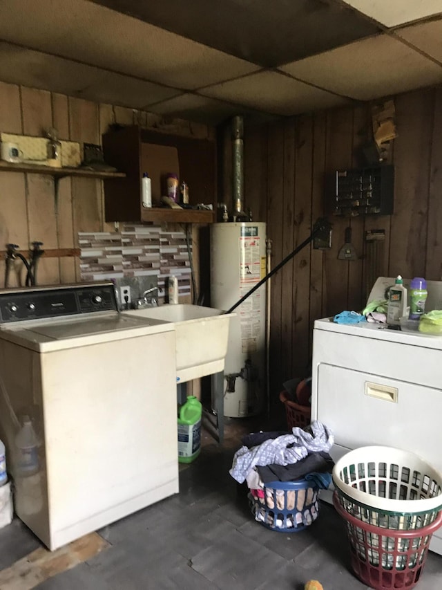 4541 Wills Rd, Lewiston, MI 49756 - washroom with water heater, independent washer and dryer, and wooden walls
