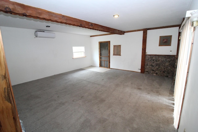7844 Gilbert Trl, Grayling, MI 49738 - empty room featuring carpet, beam ceiling, and a wall mounted air conditioner