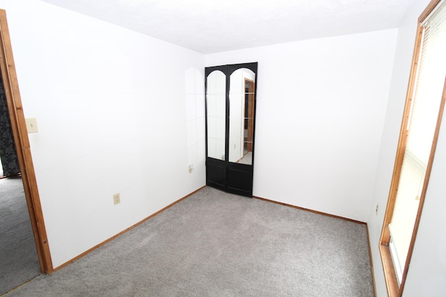 7844 Gilbert Trl, Grayling, MI 49738 - carpeted spare room with baseboards