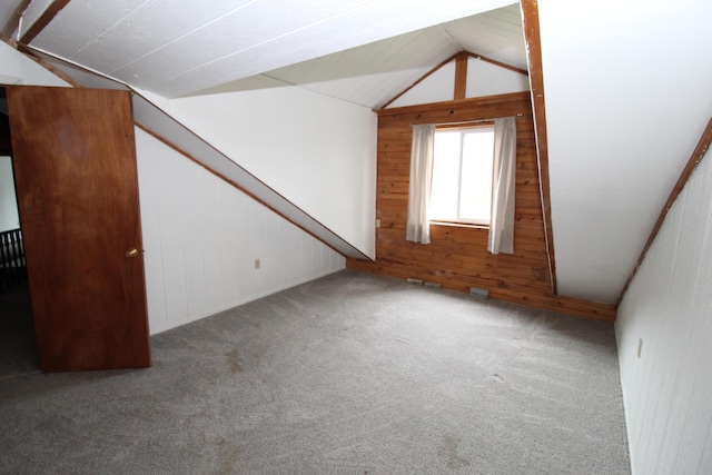 7844 Gilbert Trl, Grayling, MI 49738 - bonus room featuring wooden walls, lofted ceiling, and carpet flooring