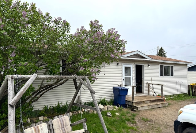 212 Scott St, Grayling, MI 49738 - back of property featuring a deck