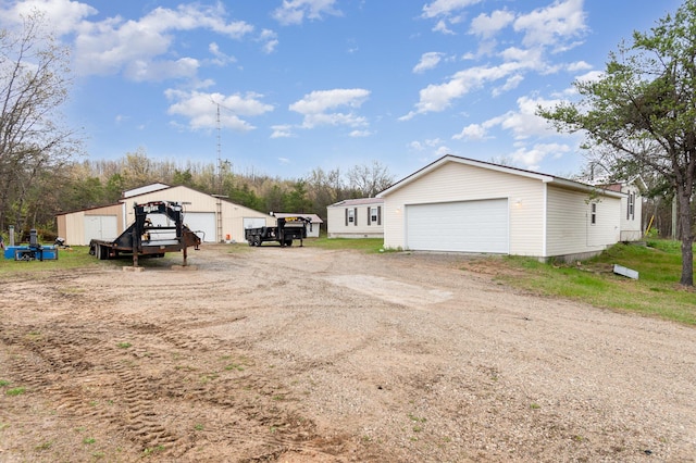 3357 E N Down River Rd, Grayling, MI 49738 - view of side of property with a detached garage and an outdoor structure