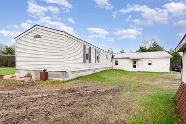 3357 E N Down River Rd, Grayling, MI 49738 - rear view of house with a lawn