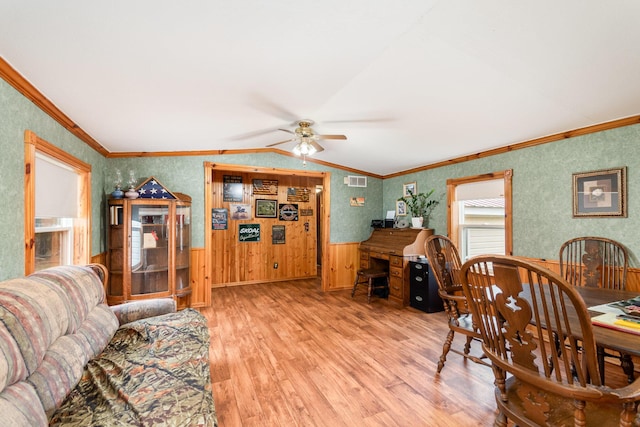 3357 E N Down River Rd, Grayling, MI 49738 - living room featuring a ceiling fan, light wood-type flooring, crown molding, and wallpapered walls