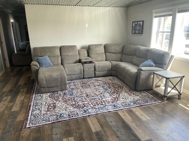 7557 Loop Rd, Posen, MI 49776 - living area featuring wood finished floors and baseboards