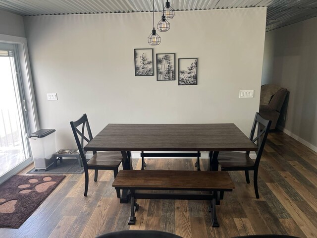 7557 Loop Rd, Posen, MI 49776 - dining room featuring wood finished floors and baseboards