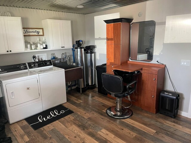 7557 Loop Rd, Posen, MI 49776 - laundry room with washing machine and dryer, cabinet space, and dark wood-style flooring