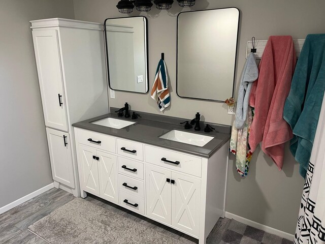 7557 Loop Rd, Posen, MI 49776 - full bath with double vanity and baseboards
