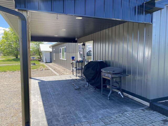 7557 Loop Rd, Posen, MI 49776 - view of patio featuring area for grilling