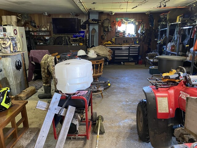7557 Loop Rd, Posen, MI 49776 - garage with a workshop area