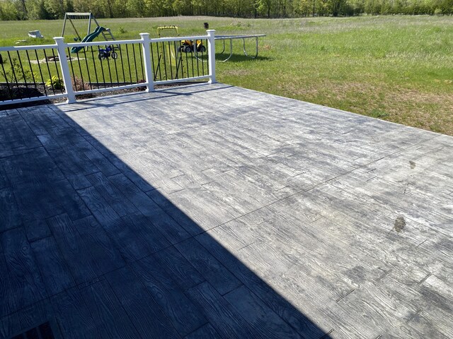 7557 Loop Rd, Posen, MI 49776 - wooden terrace with a yard