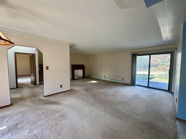 11030 S Stephan Bridge Rd, Roscommon, MI 48653 - unfurnished living room featuring baseboard heating, carpet flooring, baseboards, arched walkways, and a textured ceiling