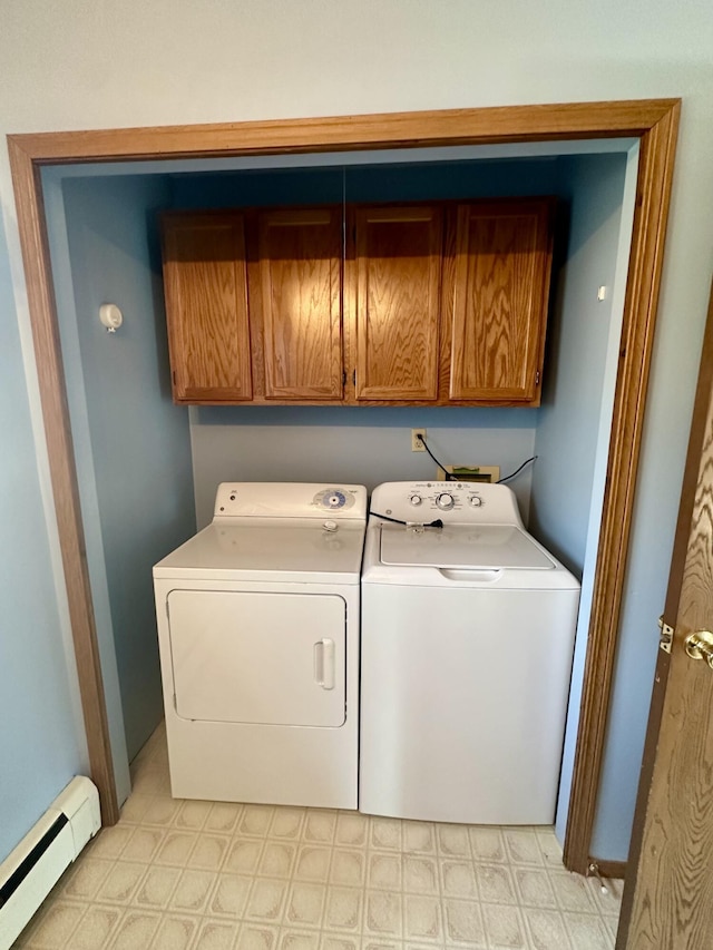 11030 S Stephan Bridge Rd, Roscommon, MI 48653 - laundry area featuring cabinet space, baseboard heating, separate washer and dryer, and light floors