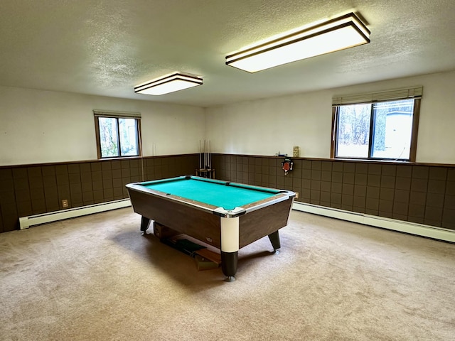 11030 S Stephan Bridge Rd, Roscommon, MI 48653 - playroom with a baseboard radiator, a textured ceiling, carpet floors, billiards, and a wainscoted wall
