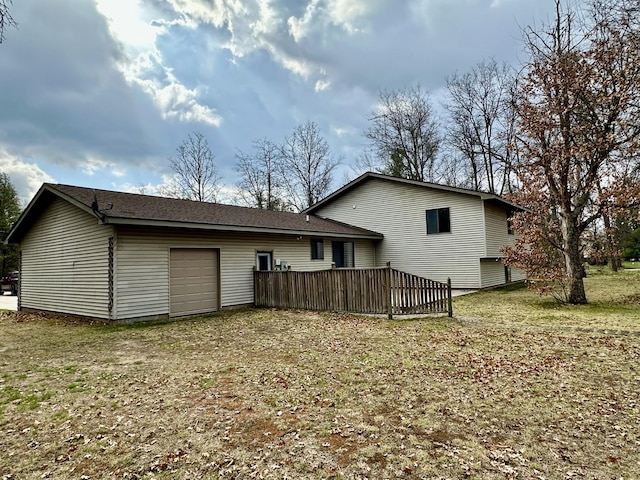 11030 S Stephan Bridge Rd, Roscommon, MI 48653 - back of house with a garage