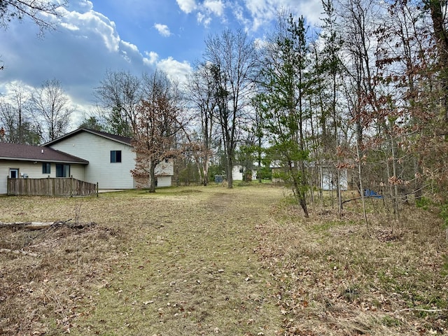 11030 S Stephan Bridge Rd, Roscommon, MI 48653 - view of green lawn featuring a deck