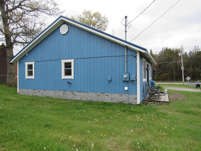 2020 Douglas Dr, Saint Helen, MI 48656 - view of side of home featuring crawl space and a yard