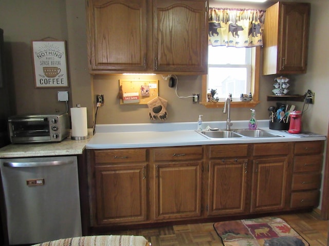 2020 Douglas Dr, Saint Helen, MI 48656 - kitchen with stainless steel dishwasher, a sink, light countertops, and brown cabinets
