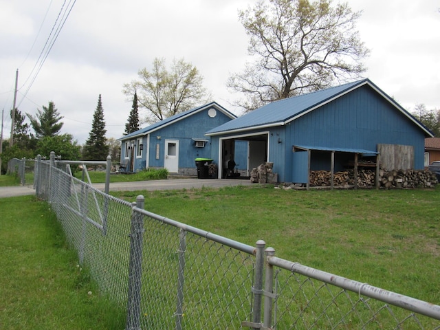 2020 Douglas Dr, Saint Helen, MI 48656 - rear view of house with driveway and metal roof