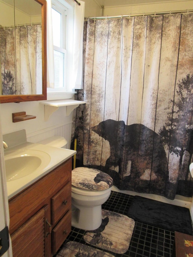 2020 Douglas Dr, Saint Helen, MI 48656 - full bathroom with tile patterned floors, vanity, toilet, and a shower with shower curtain