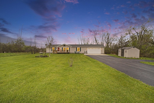 398 Vale St, Cheboygan, MI 49721 - ranch-style home with driveway, an attached garage, a front yard, and a porch