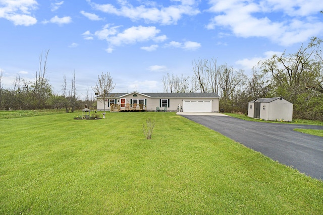 398 Vale St, Cheboygan, MI 49721 - single story home with driveway, a garage, and a front lawn