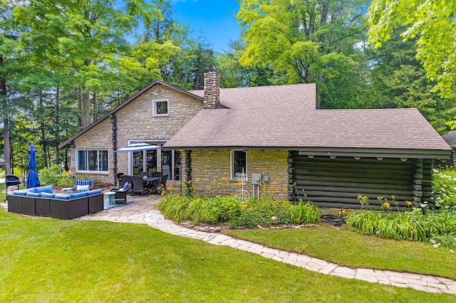 4423 Island View Dr, Gaylord, MI 49735 - back of house with an outdoor living space, stone siding, a lawn, a chimney, and a patio area