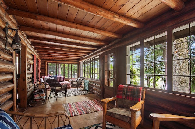 4423 Island View Dr, Gaylord, MI 49735 - sunroom / solarium featuring an outdoor living space, wood-type flooring, rustic walls, healthy amount of natural light, and wood ceiling with exposed beams